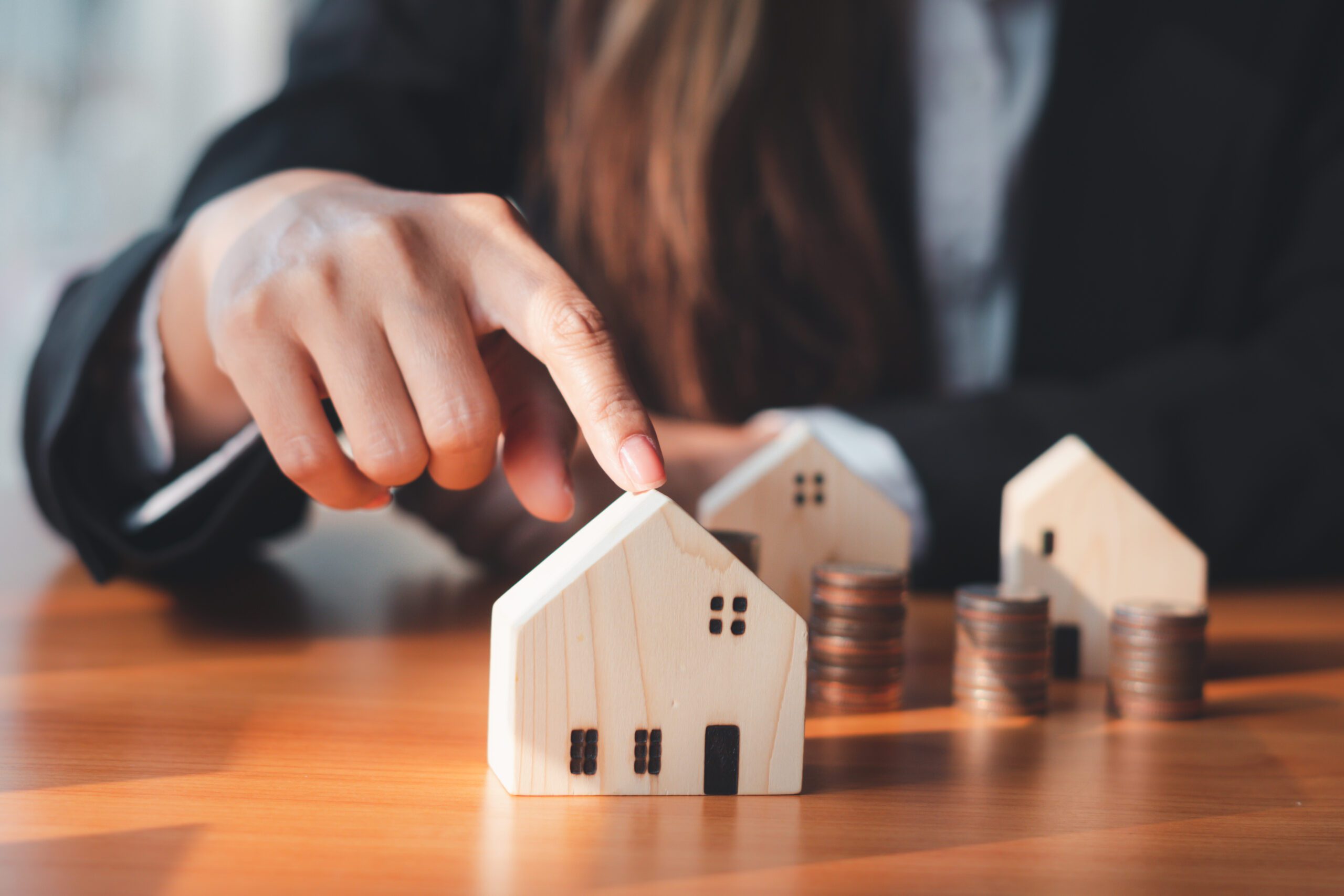 The Hand of the Businessman Guarding Close Money Saving Ideas to Buy a Home